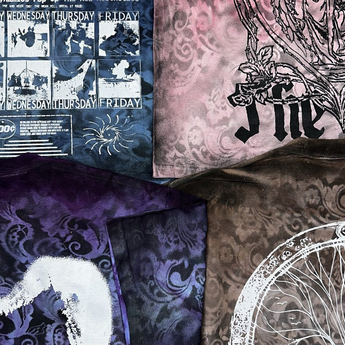 Hand-dyed MAUD screen printed tees laid flat